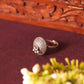 Close up of Intricate Floral Carvings and Ghungri Detailing on Antique Silver Ring