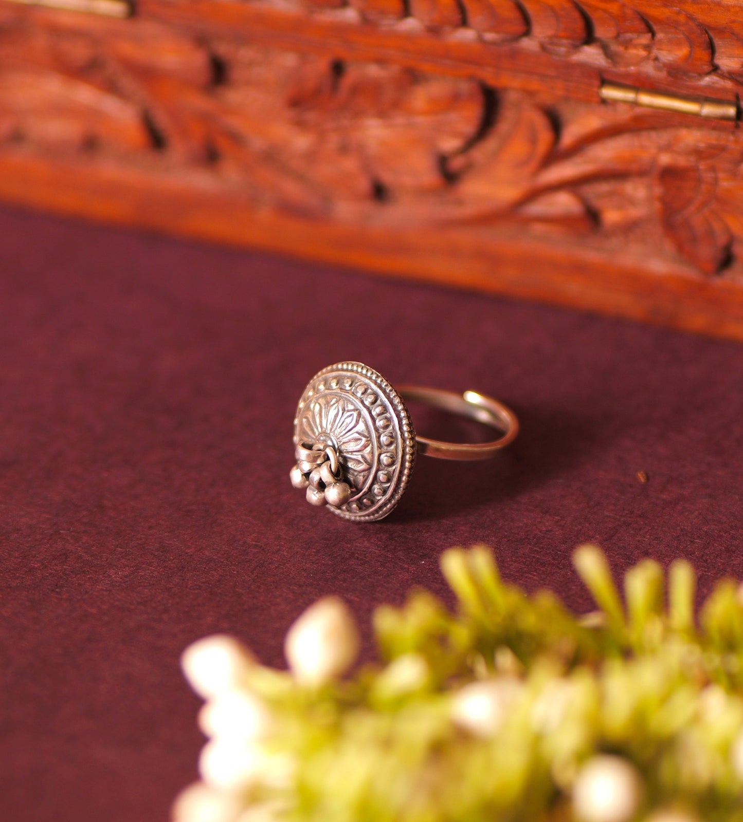 Close up of Intricate Floral Carvings and Ghungri Detailing on Antique Silver Ring