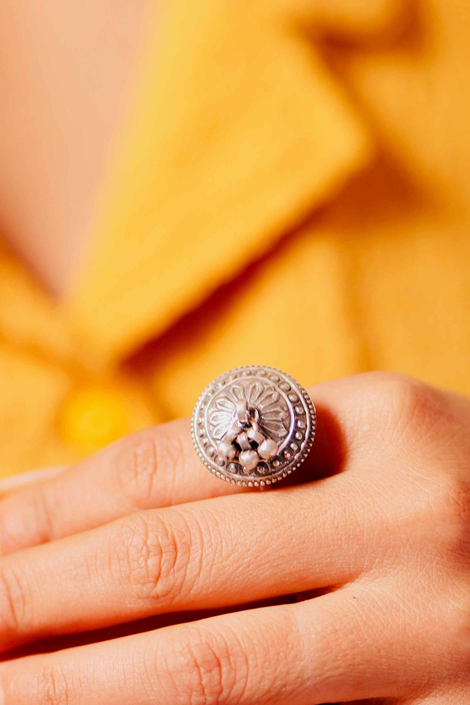 Woman wearing Bold Oxidized Silver Dome Ring with Ethnic Outfit